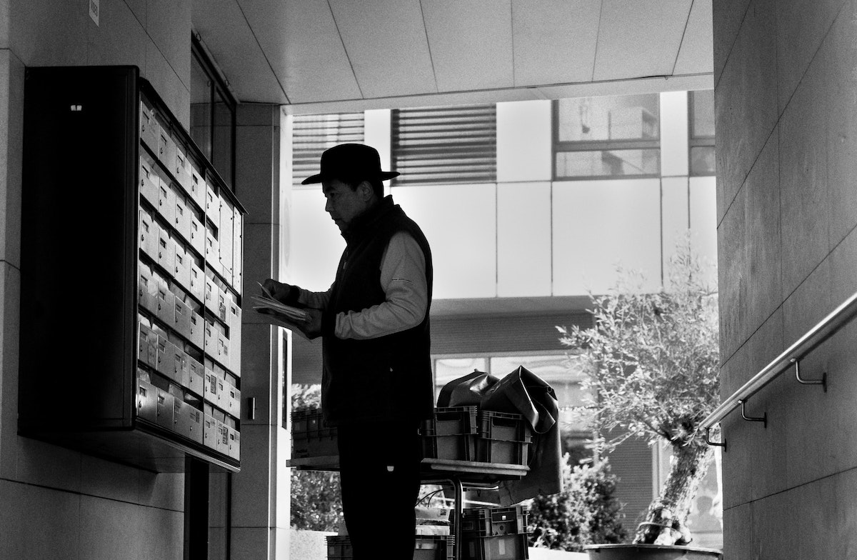 a man delivering letters